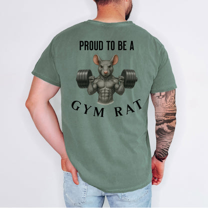Person wearing a moss T-shirt featuring a bold back design with the phrase “Proud to Be a Gym Rat” above and below a muscular cartoon rat holding heavy dumbbells. The strong, flexing rat graphic symbolizes dedication to fitness and weightlifting, making this shirt perfect for gym lovers, bodybuilders, and strength training enthusiasts.