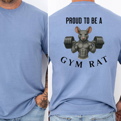 Person wearing a washed denim T-shirt featuring a bold back design with the phrase “Proud to Be a Gym Rat” above and below a muscular cartoon rat holding heavy dumbbells. The strong, flexing rat graphic symbolizes dedication to fitness and weightlifting, making this shirt perfect for gym lovers, bodybuilders, and strength training enthusiasts.