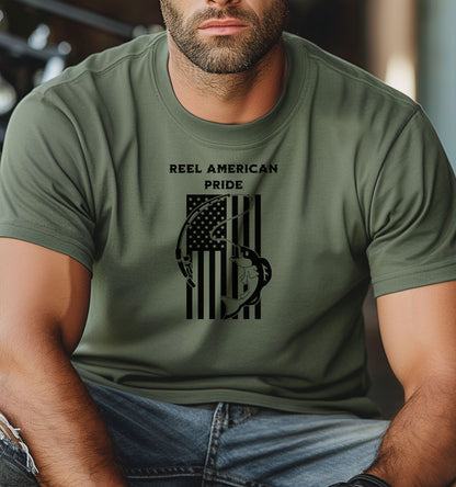 Reel American Pride T-shirt featuring a bold fishing-themed design with the phrase 'Reel American Pride' above an American flag graphic. A large fish is hooked on a fishing line overlaying the flag’s stripes. Printed on a moss unisex tee, this patriotic fishing shirt is perfect for anglers who love both their country and the sport. Ideal for summer outings, fishing trips, or casual everyday wear.