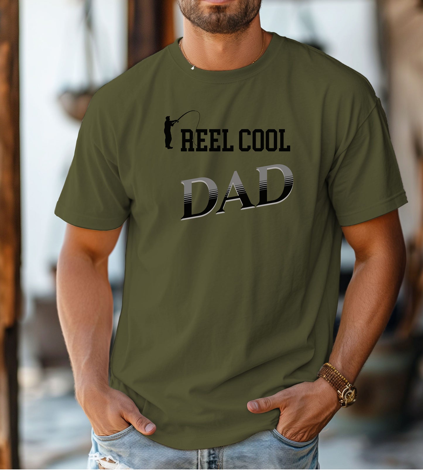 Reel Cool Dad T-shirt featuring a playful fishing-themed design with the phrase 'Reel Cool Dad' and a silhouette of a fisherman casting a line. Printed on a hemp color unisex tee, this fun graphic is perfect for dads who love fishing and spending time outdoors. Ideal for Father’s Day, birthdays, or casual wear for the proud angler dad.
