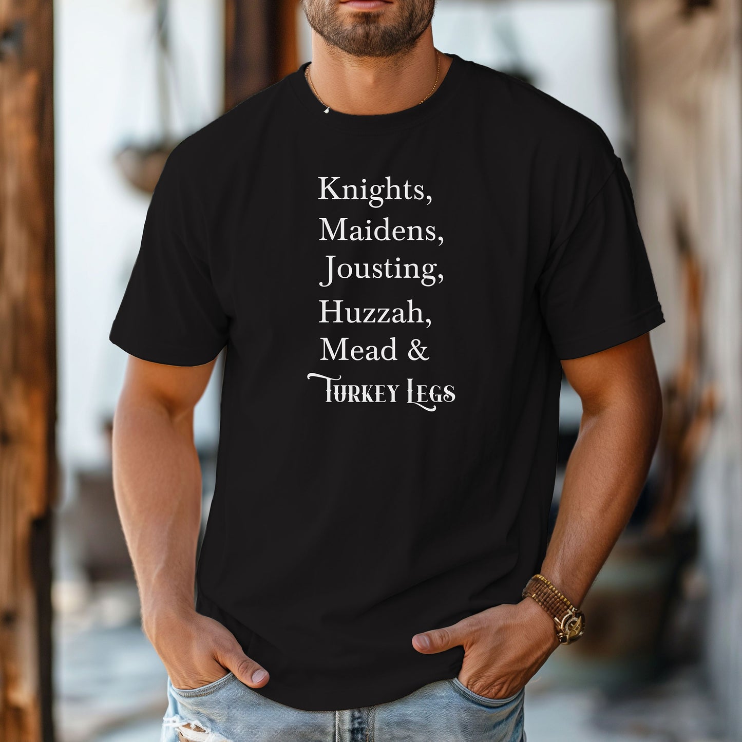 Person wearing a black Renaissance Faire-themed T-shirt featuring a playful list-style text: “Knights, Maidens, Jousting, Huzzah, Mead & Turkey Legs.” The design uses elegant medieval-inspired fonts to celebrate classic faire experiences, perfect for fairgoers who love the festive mix of tradition, adventure, and hearty food.