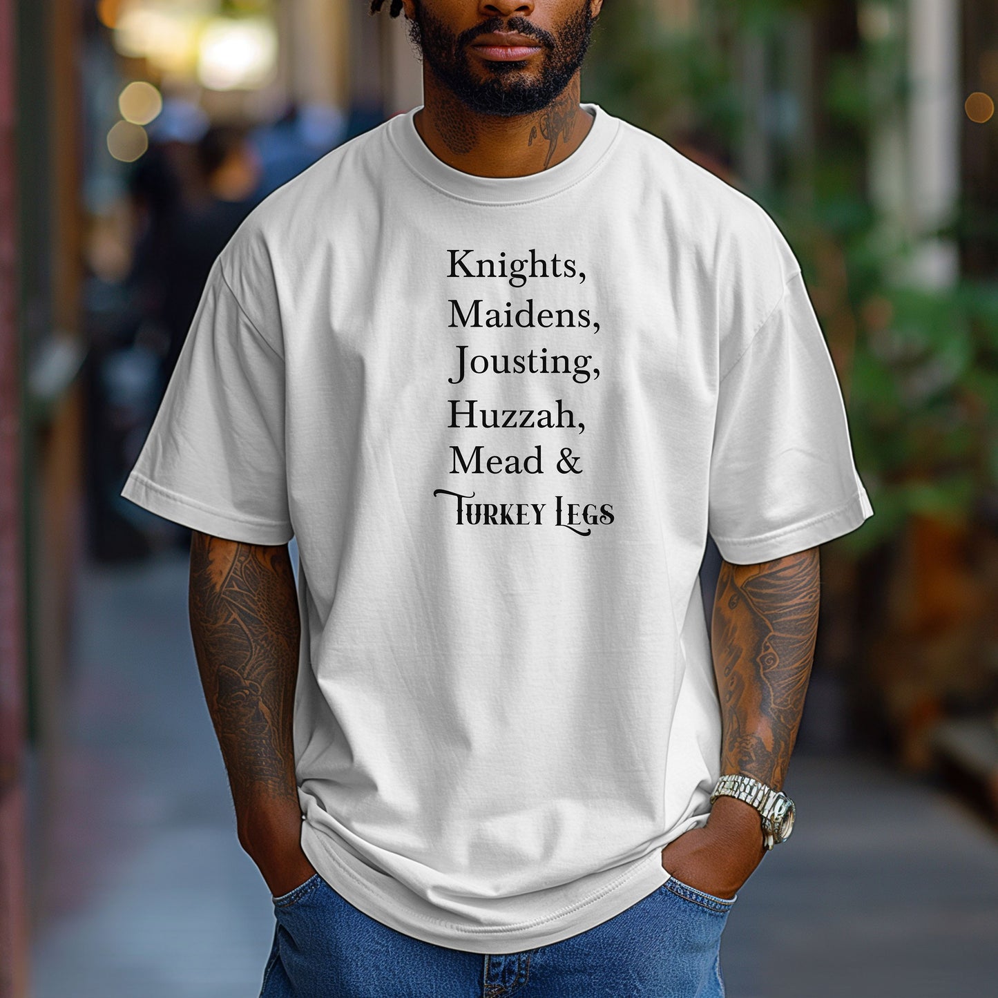 Person wearing a White Renaissance Faire-themed T-shirt featuring a playful list-style text: “Knights, Maidens, Jousting, Huzzah, Mead & Turkey Legs.” The design uses elegant medieval-inspired fonts to celebrate classic faire experiences, perfect for fairgoers who love the festive mix of tradition, adventure, and hearty food.