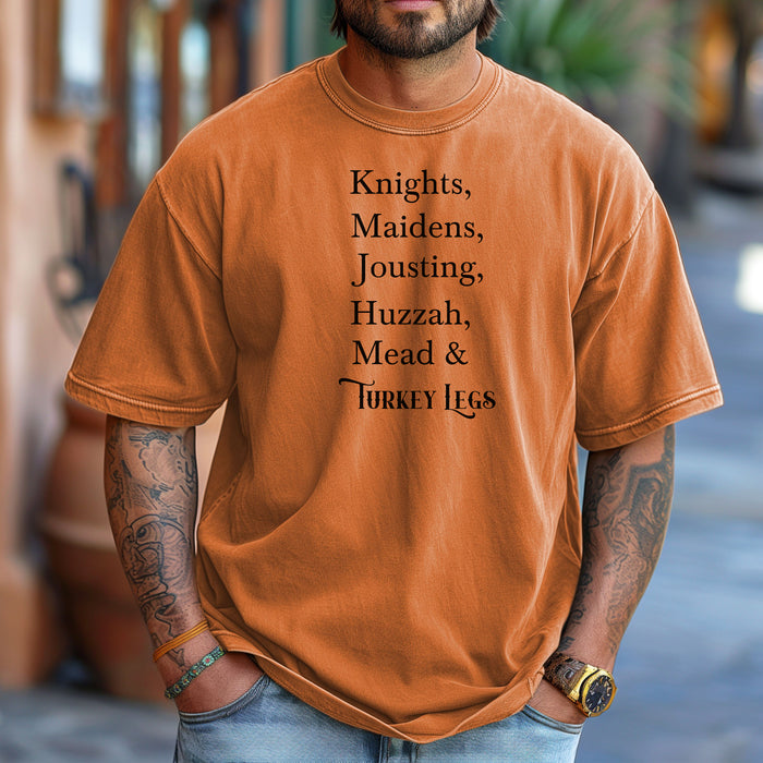 Person wearing a Yam Renaissance Faire-themed T-shirt featuring a playful list-style text: “Knights, Maidens, Jousting, Huzzah, Mead & Turkey Legs.” The design uses elegant medieval-inspired fonts to celebrate classic faire experiences, perfect for fairgoers who love the festive mix of tradition, adventure, and hearty food.