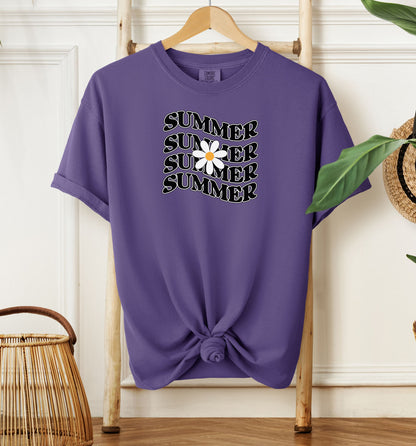 Grape T-shirt featuring a retro wavy text design that repeats the word “SUMMER” four times in bold black vintage-style letters. A large white daisy with a yellow center overlaps the middle of the design, adding a cheerful floral touch. Perfect for sunny days, vacations, and casual outings, this shirt has a nostalgic, laid-back summer vibe.