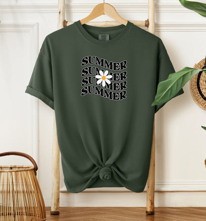 Hemp color T-shirt featuring a retro wavy text design that repeats the word “SUMMER” four times in bold black vintage-style letters. A large white daisy with a yellow center overlaps the middle of the design, adding a cheerful floral touch. Perfect for sunny days, vacations, and casual outings, this shirt has a nostalgic, laid-back summer vibe.