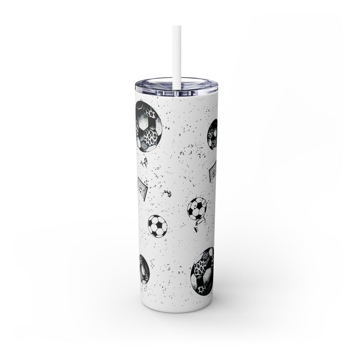 Soccer Mom Skinny Tumbler – 20 oz featuring a black-and-white coquette bow made of soccer balls with a leopard print accent. Surrounded by small soccer ball and goal illustrations on a speckled background, this stylish and durable tumbler is perfect for keeping drinks hot or cold. A fun and practical accessory for proud soccer moms to show their team spirit during practices, games, and everyday use.