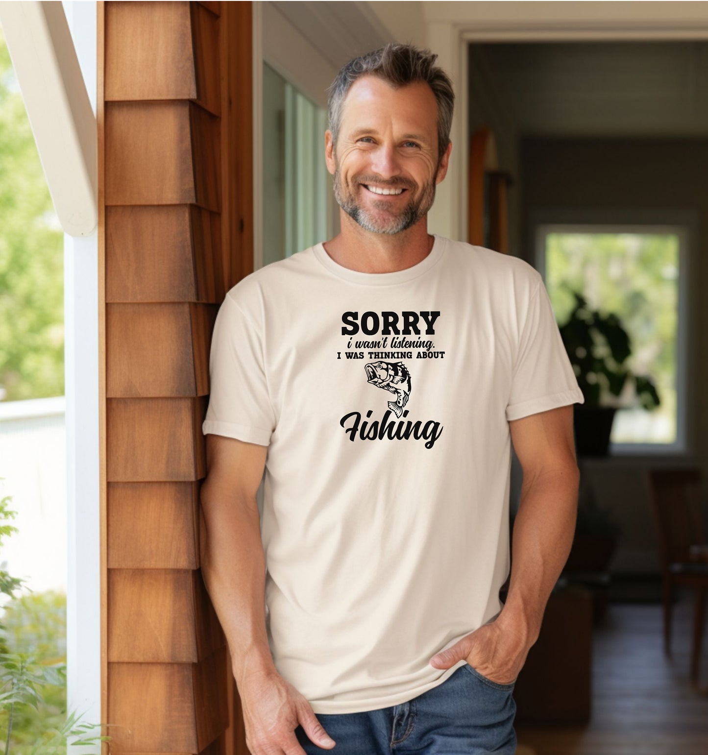 SORRY I wasn’t listening. I was thinking about Fishing' T-shirt featuring bold and script fonts with a detailed fish illustration. Printed on an ivory unisex tee, this humorous design is perfect for fishing enthusiasts who’d rather be on the water than anywhere else. Ideal for casual wear, fishing trips, or as a fun gift for anglers and dads who love the sport.