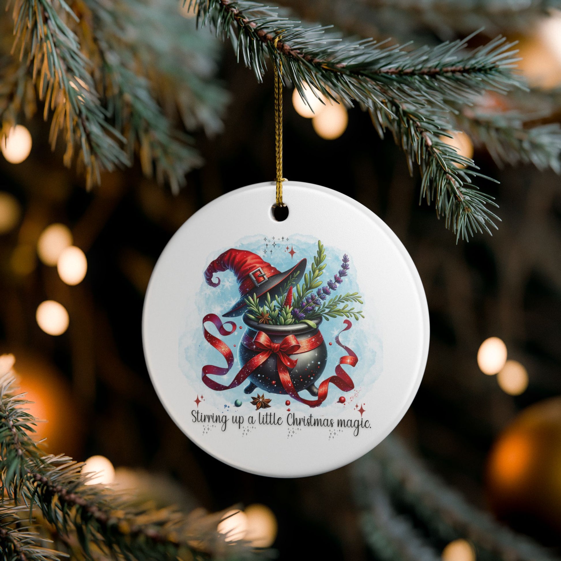 Decorative Christmas ornament with a witch's hat and potion design, hanging on a tree.
