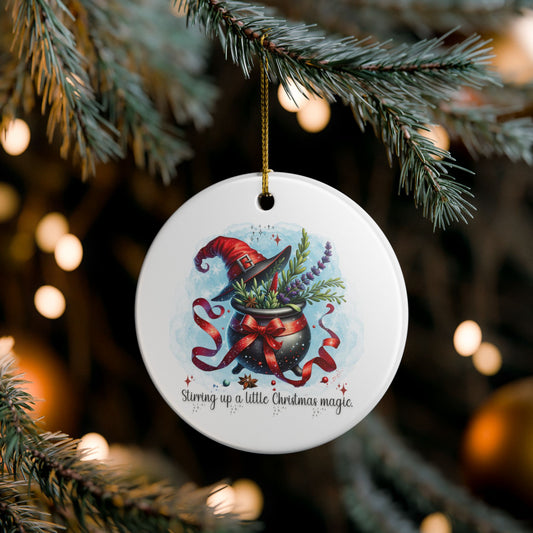 Decorative Christmas ornament with a witch's hat and potion design, hanging on a tree.