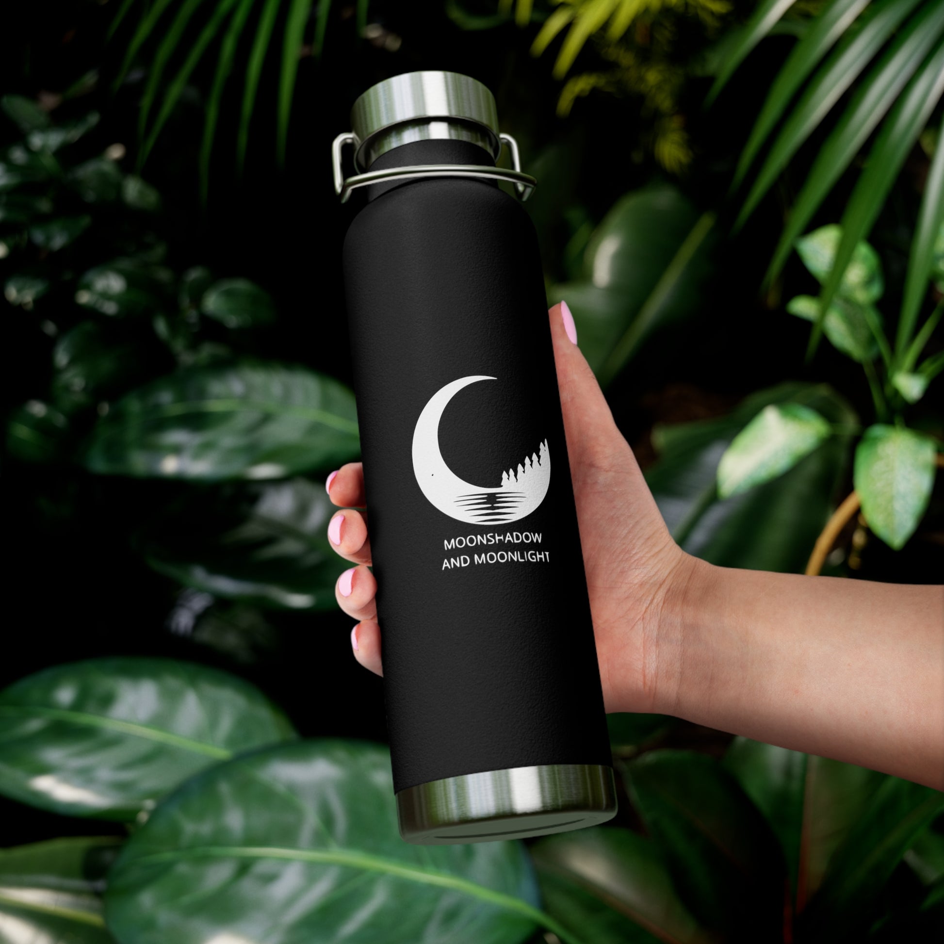 Stylish MoonShadow & MoonLight Insulated Water Bottle - Black Person holding bottle