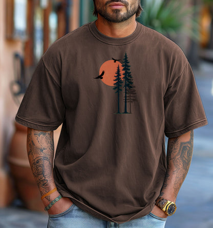 Sunset Pines & Soaring Eagles T-shirt featuring a minimalist nature design with tall pine trees silhouetted against a warm orange sun. Two eagles glide through the sky, adding a touch of wilderness and freedom. Printed on a espresso unisex tee, this nature-inspired graphic is perfect for outdoor lovers, hikers, and those who appreciate serene, scenic beauty.