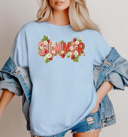Chambray light blue T-shirt featuring a vibrant “SUMMER” graphic decorated with red strawberries, green leaves, and white daisies. The fresh, playful design captures a bright and cheerful summer vibe, perfect for casual warm-weather outfits. 