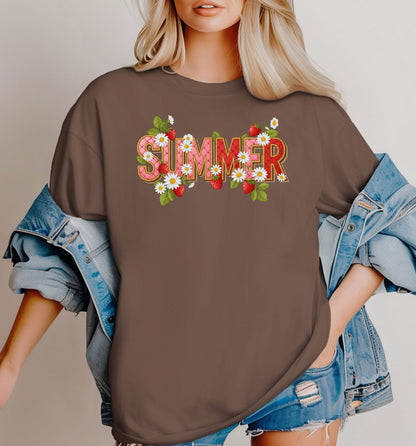 Espresso T-shirt featuring a vibrant “SUMMER” graphic decorated with red strawberries, green leaves, and white daisies. The fresh, playful design captures a bright and cheerful summer vibe, perfect for casual warm-weather outfits. 