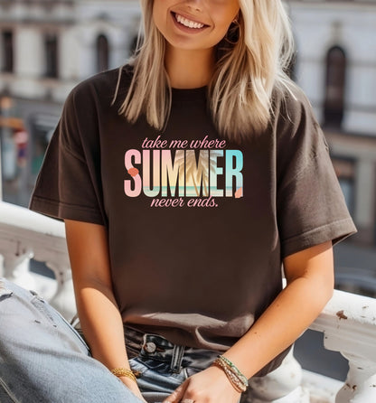 Brown T-shirt featuring the text “Take me where summer never ends” with the words “take me where SUMMER never ends”.  SUMMER is filled with a tropical beach scene including palm trees, seashells, and ocean waves. Perfect for beach lovers and summer enthusiasts, this vibrant vacation-themed shirt captures a fun, sunny vibe for casual outings, travel, or coastal adventures.