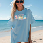 Ocean Blue T-shirt featuring the text “Take me where summer never ends” with the words “take me where SUMMER never ends”.  SUMMER is filled with a tropical beach scene including palm trees, seashells, and ocean waves. Perfect for beach lovers and summer enthusiasts, this vibrant vacation-themed shirt captures a fun, sunny vibe for casual outings, travel, or coastal adventures.