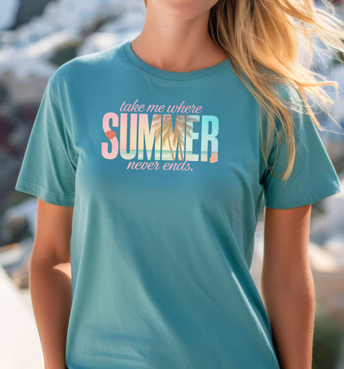 Turqoise T-shirt featuring the text “Take me where summer never ends” with the words “take me where SUMMER never ends”.  SUMMER is filled with a tropical beach scene including palm trees, seashells, and ocean waves. Perfect for beach lovers and summer enthusiasts, this vibrant vacation-themed shirt captures a fun, sunny vibe for casual outings, travel, or coastal adventures.