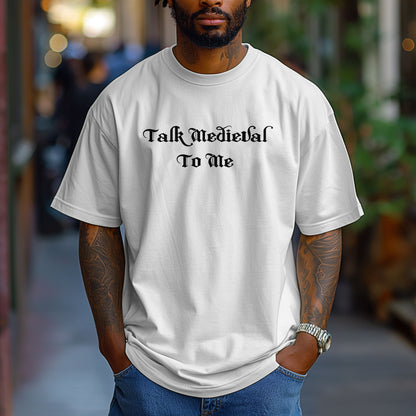 White T-shirt featuring the phrase “Talk Medieval To Me” in a bold, Gothic-style blackletter font. Perfect for Renaissance Faire lovers, history buffs, and medieval festival goers who enjoy witty and playful designs that show off their love for knights, castles, and all things medieval.