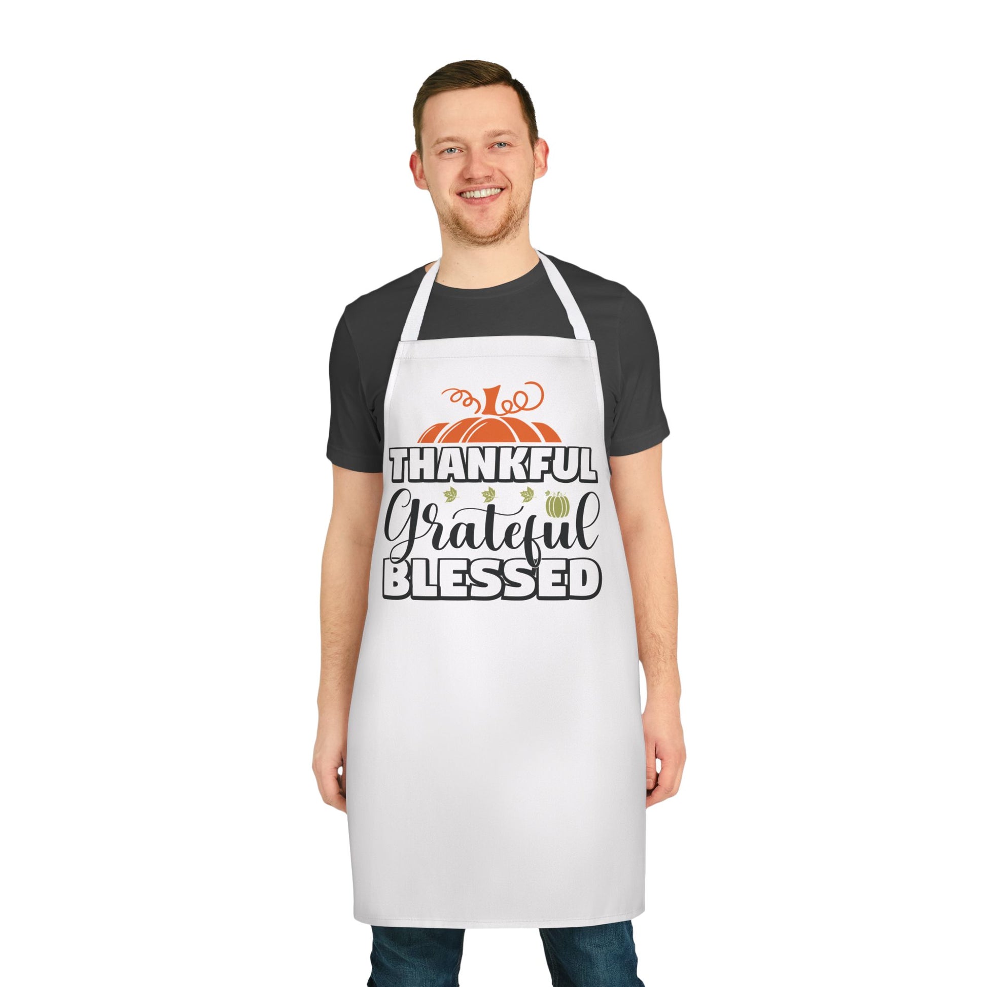 White apron featuring a fall-themed design with pumpkins and the words “Thankful, Grateful, Blessed,” perfect for Thanksgiving cooking and seasonal entertaining.