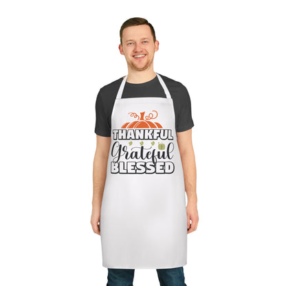 White apron featuring a fall-themed design with pumpkins and the words “Thankful, Grateful, Blessed,” perfect for Thanksgiving cooking and seasonal entertaining.