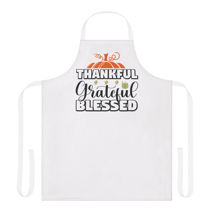 White apron featuring a fall-themed design with pumpkins and the words “Thankful, Grateful, Blessed,” perfect for Thanksgiving cooking and seasonal entertaining.