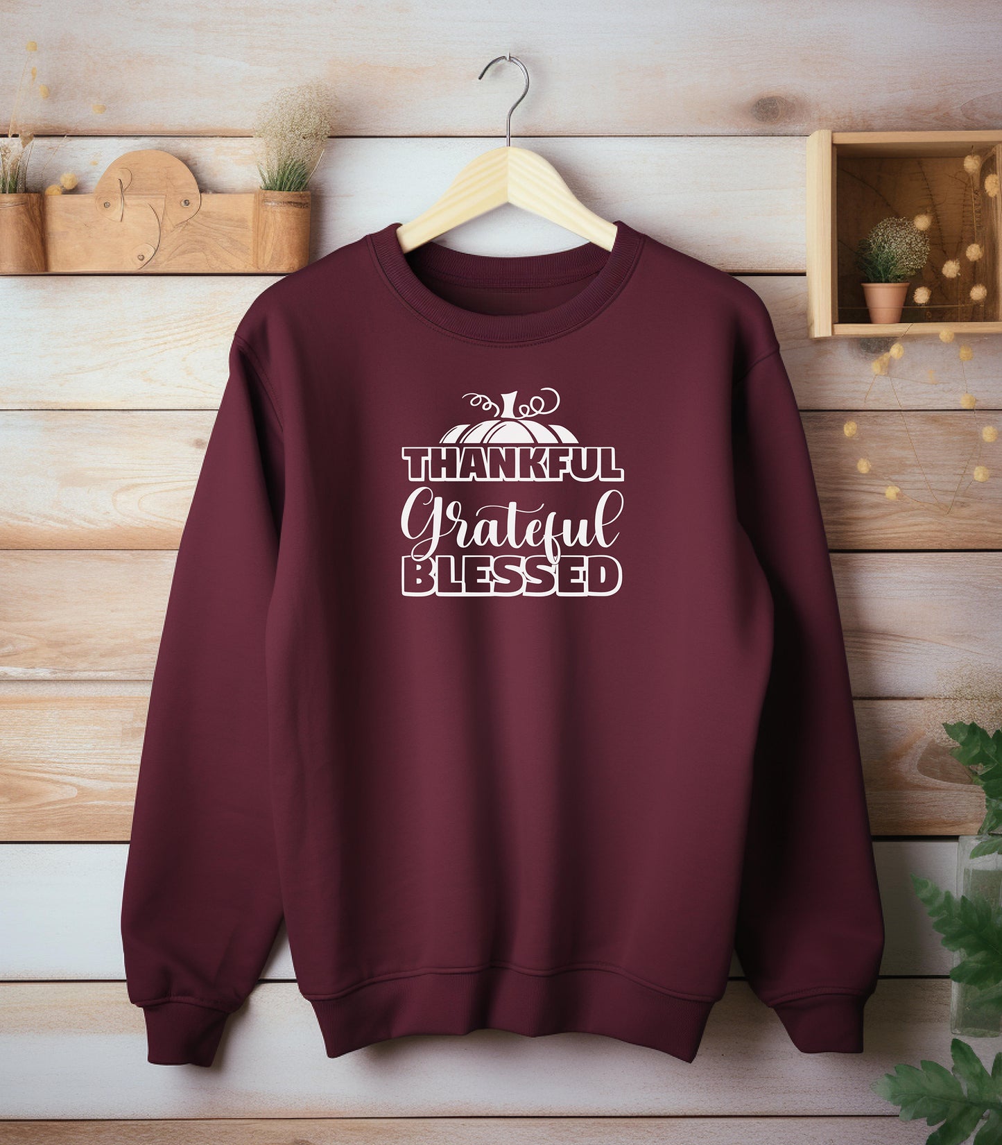 A “Thankful Grateful Blessed” Thanksgiving sweatshirt, featuring a festive pumpkin graphic, styled for cozy fall, autumn outfits and Thanksgiving celebrations