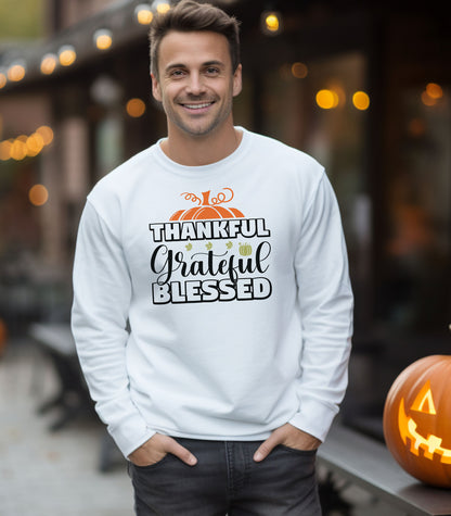 A “Thankful Grateful Blessed” Thanksgiving sweatshirt, featuring a festive pumpkin graphic, styled for cozy fall, autumn outfits and Thanksgiving celebrations