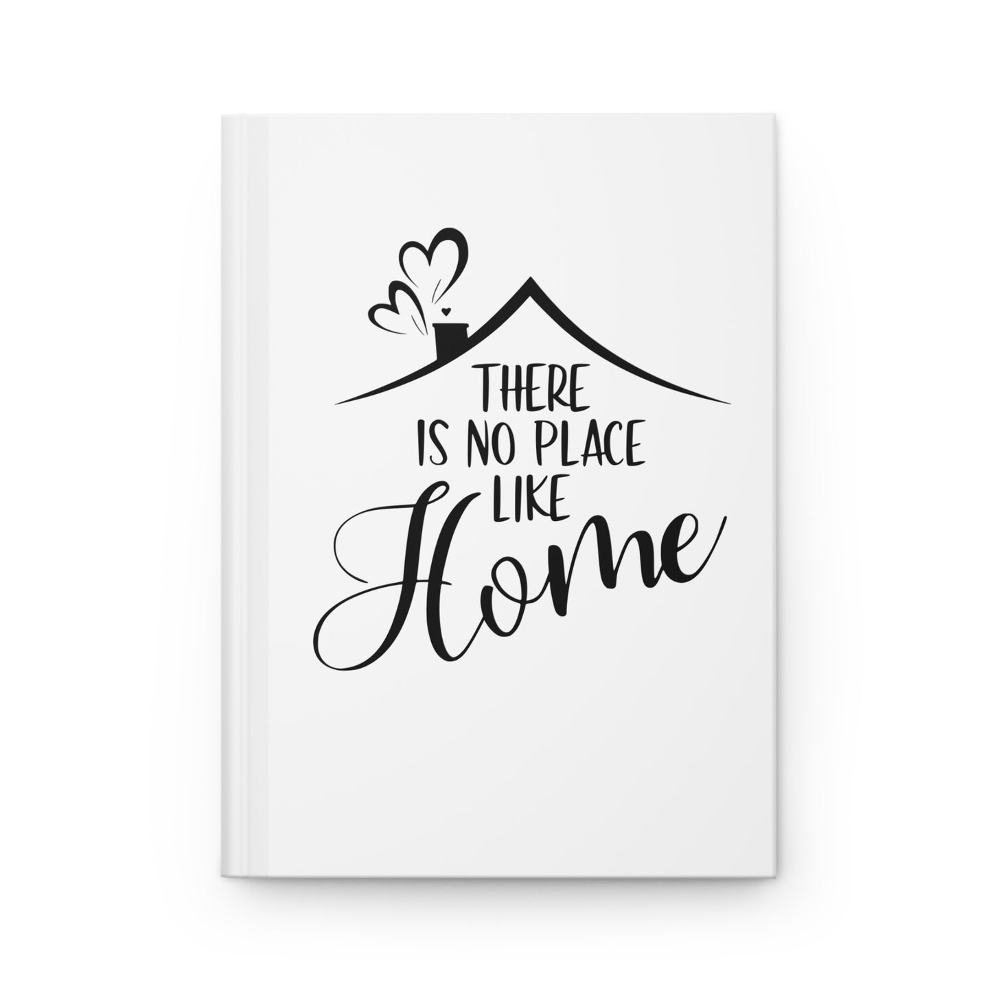 White hardcover journal with black text 'There is no place like home' and a house illustration on a white background
