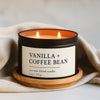 Vanilla and coffee bean soy wax blend candle in a black matte 8 oz candle tin on a wooden coaster with a beige cloth background