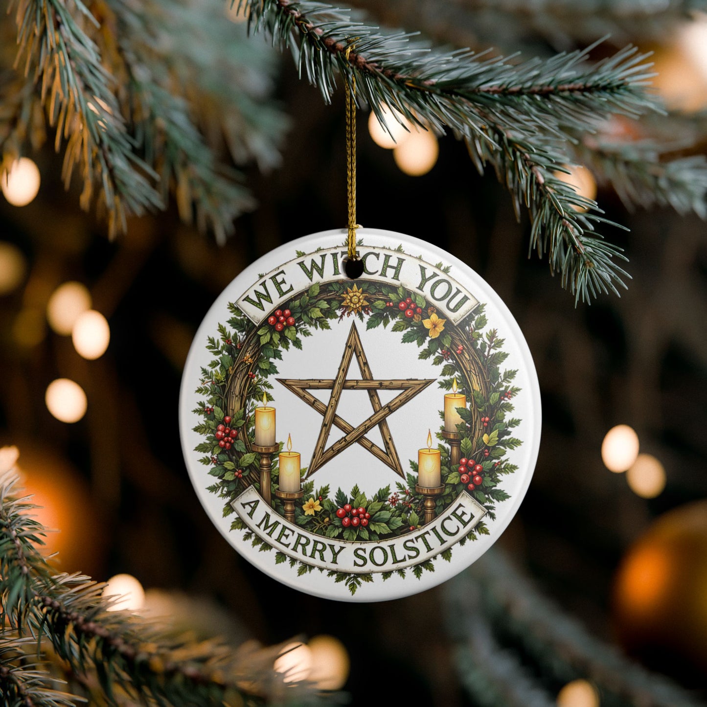 Decorative Solstice ornament with pentacle design and festive text, hanging on a tree.