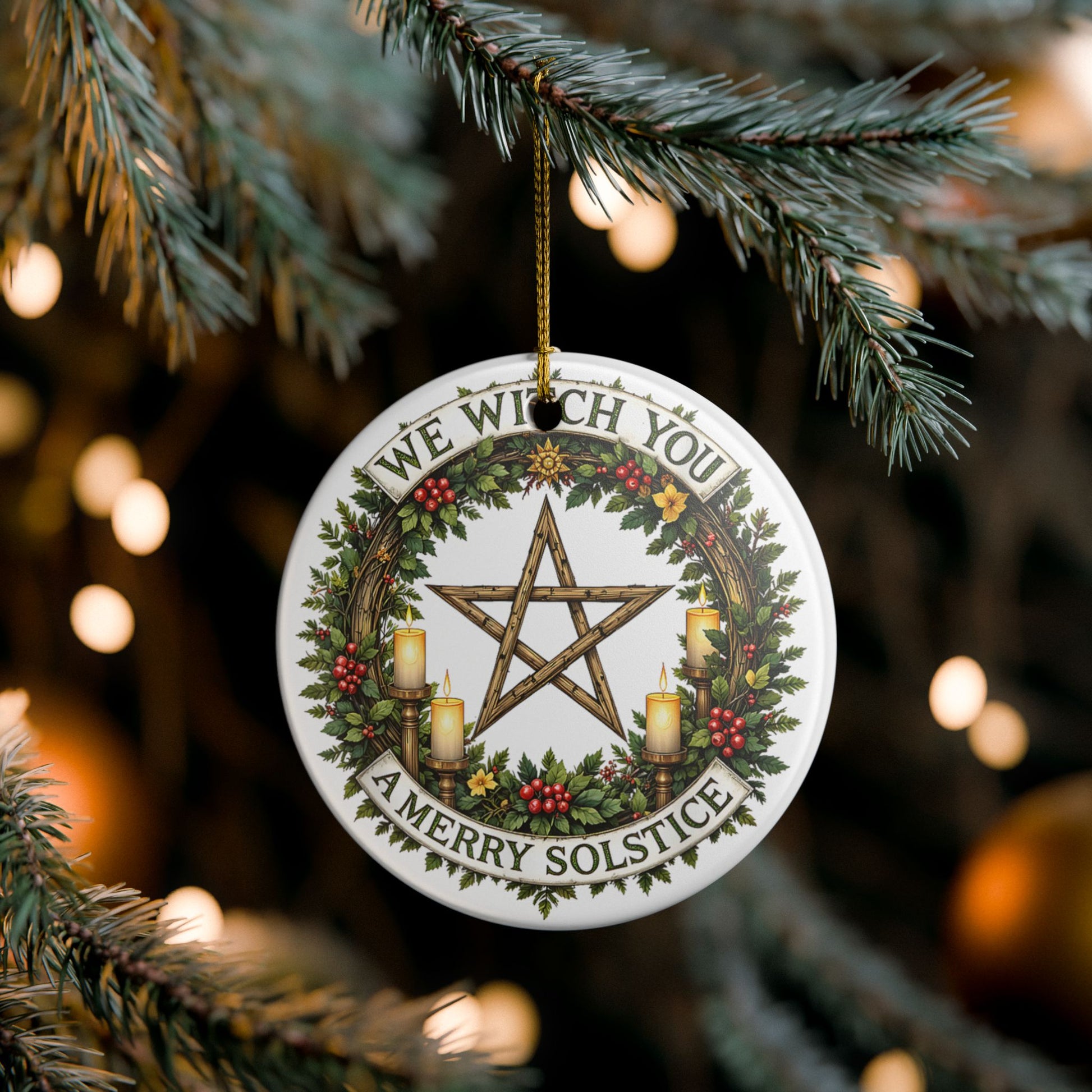 Decorative Solstice ornament with pentacle design and festive text, hanging on a tree.