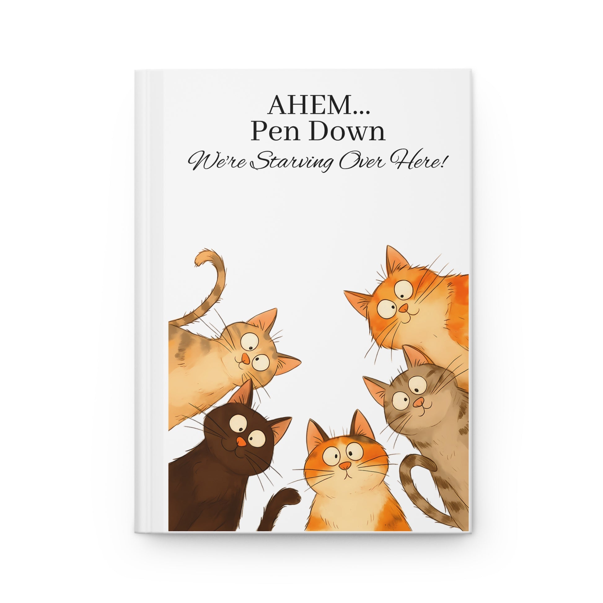 Whimsical hardcover journal with cartoon cats and humorous text on a white background