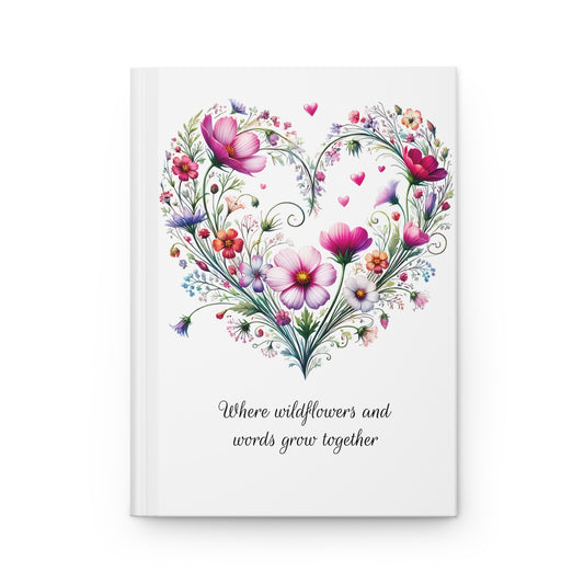 Wildflower floral heart design on a white background with text 'Where wildflowers and words grow together'.