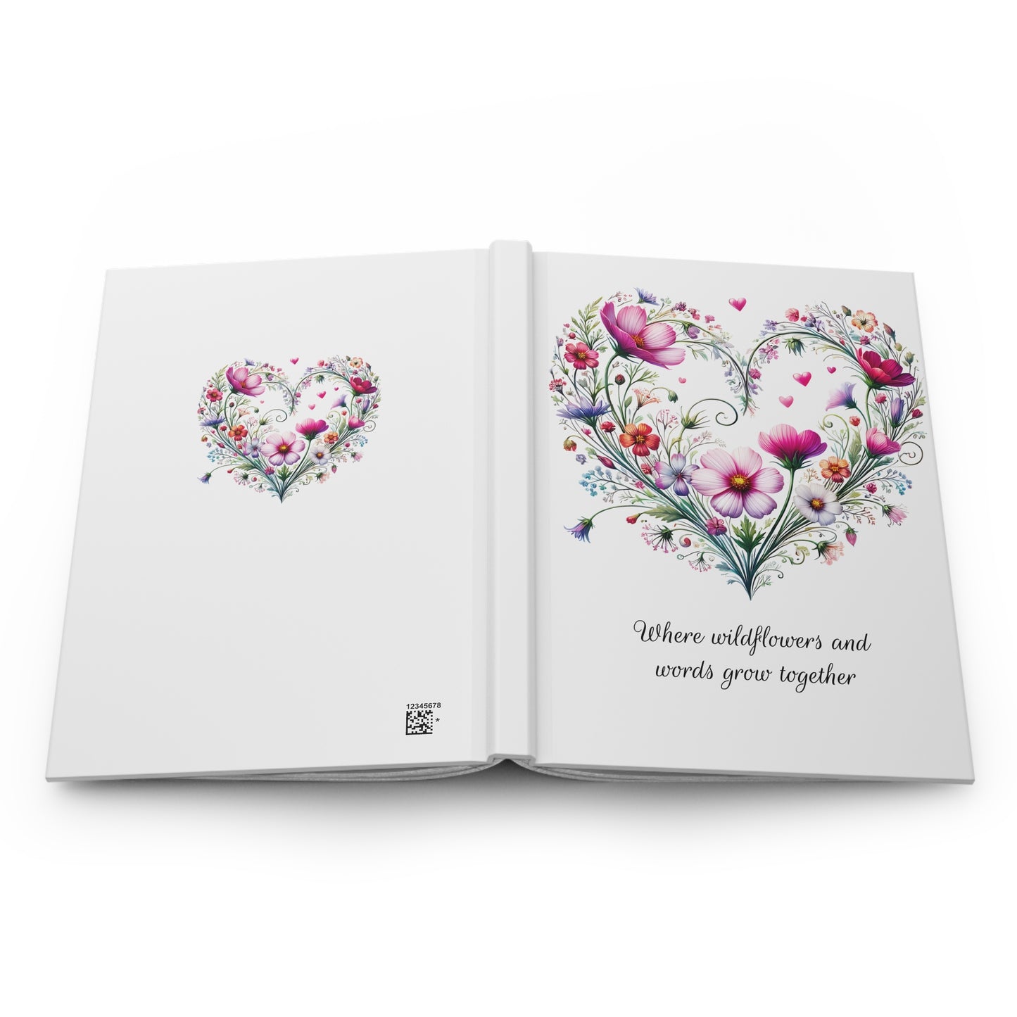 Open book with wildflower floral heart design on a white background