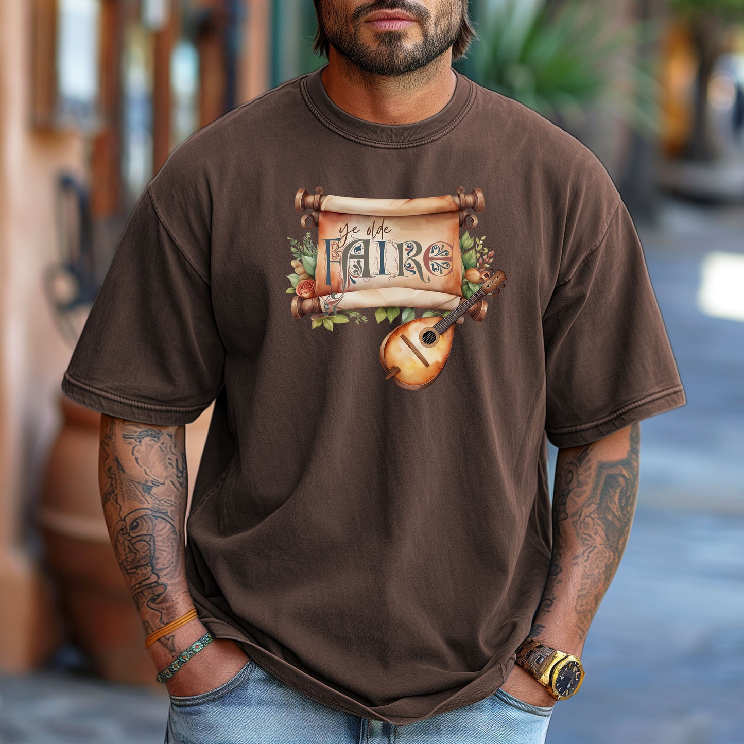 Espresso T-shirt featuring a whimsical Renaissance Faire design with the words “Ye Olde Faire” written on a scroll accented by flowers and greenery, alongside a medieval-style lute. Perfect for festival goers, music lovers, and fans of historical fairs, knights, and old-world charm.