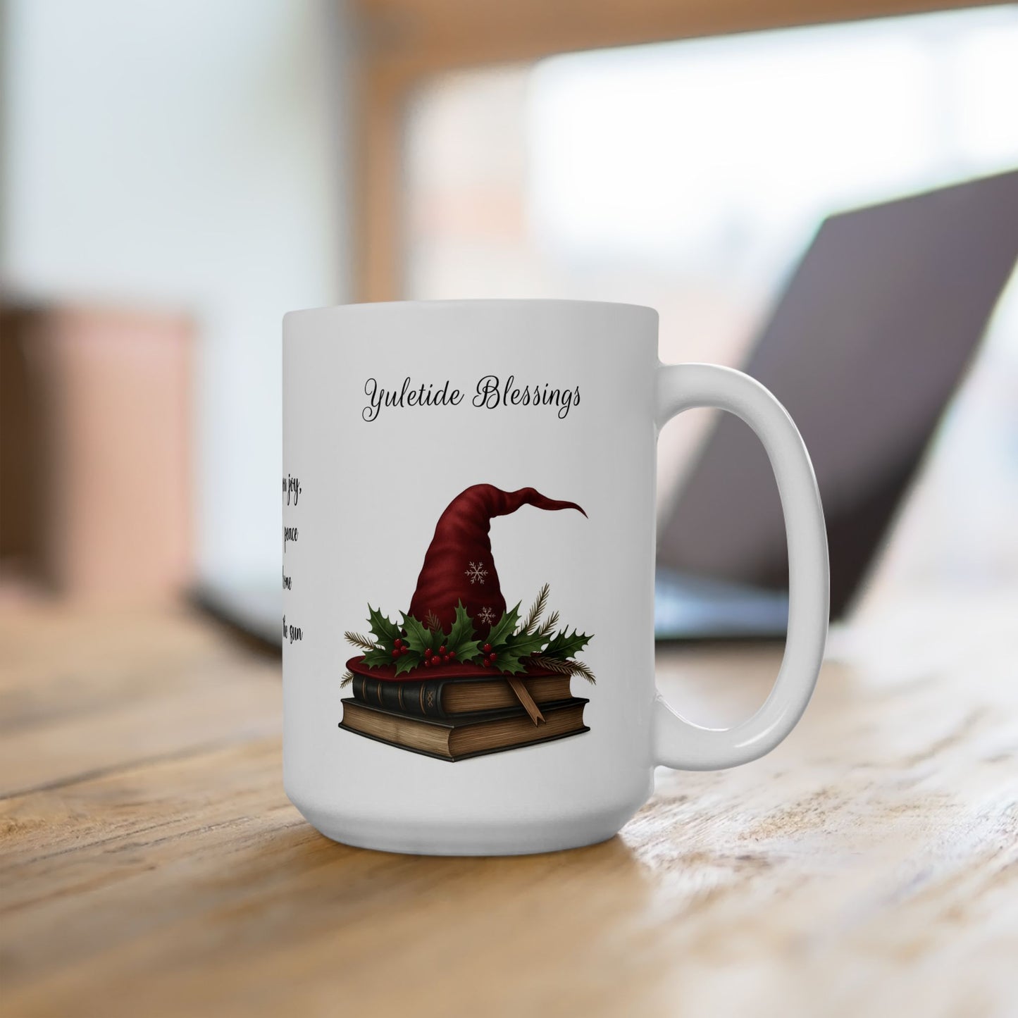 White ceramic mug with a red witch hat and books design on a wooden surface.